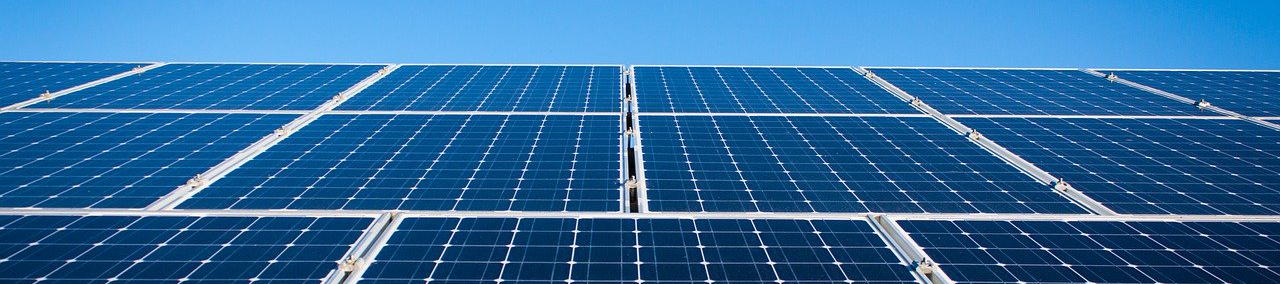 Array of solar panels and blue sky